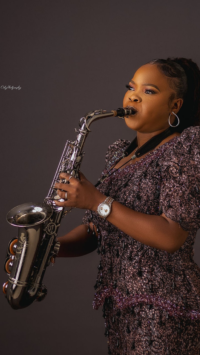 Funmisax playing the saxophone