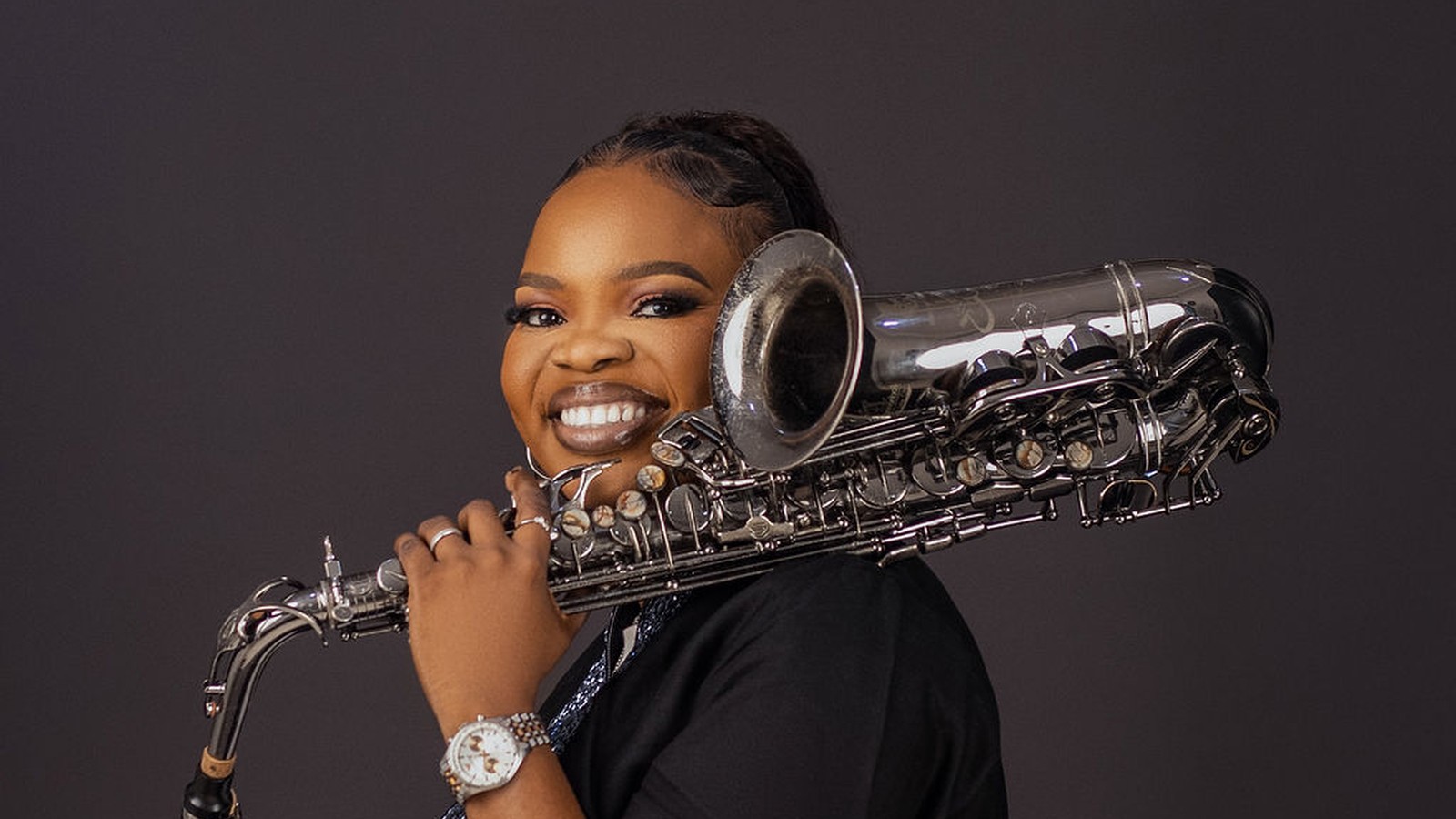 Funmisax with her saxophone
