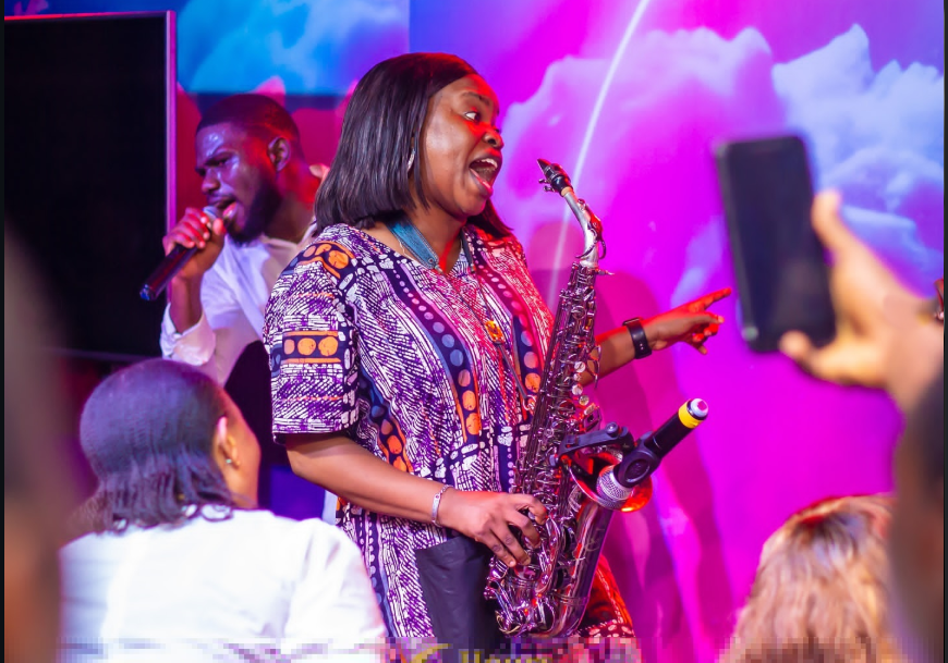 Funmisax singing and engaging the crowd